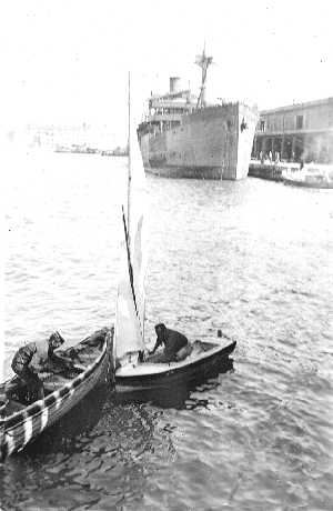 Waller and his dinghy, with Garrard