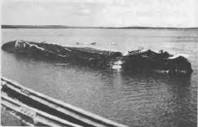 The Australian cargo ship NEPTUNA sunk alongside the main wharf at Darwin.